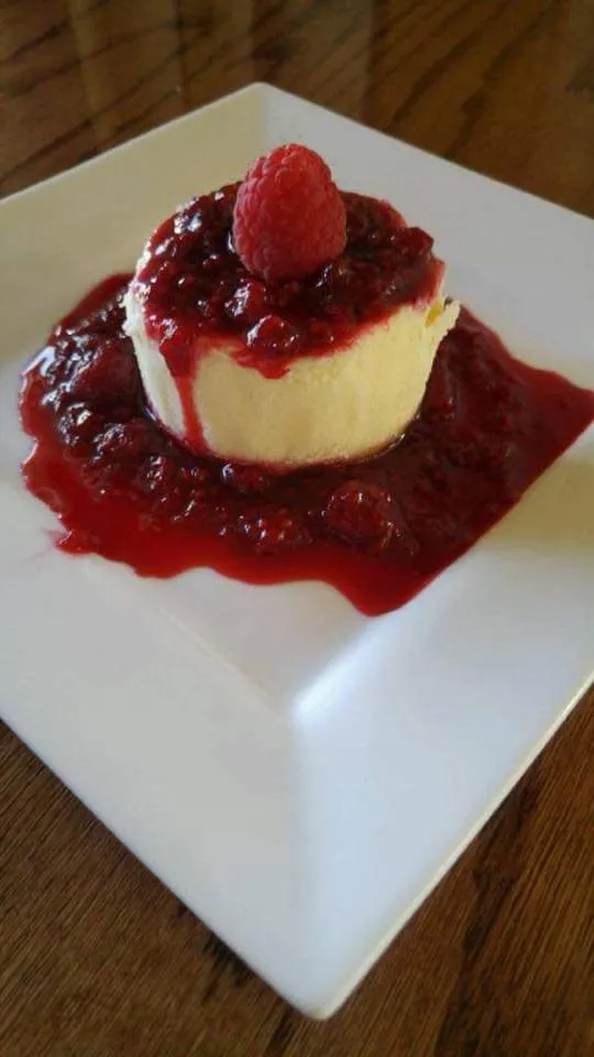 Cheesecake topped with raspberry sauce