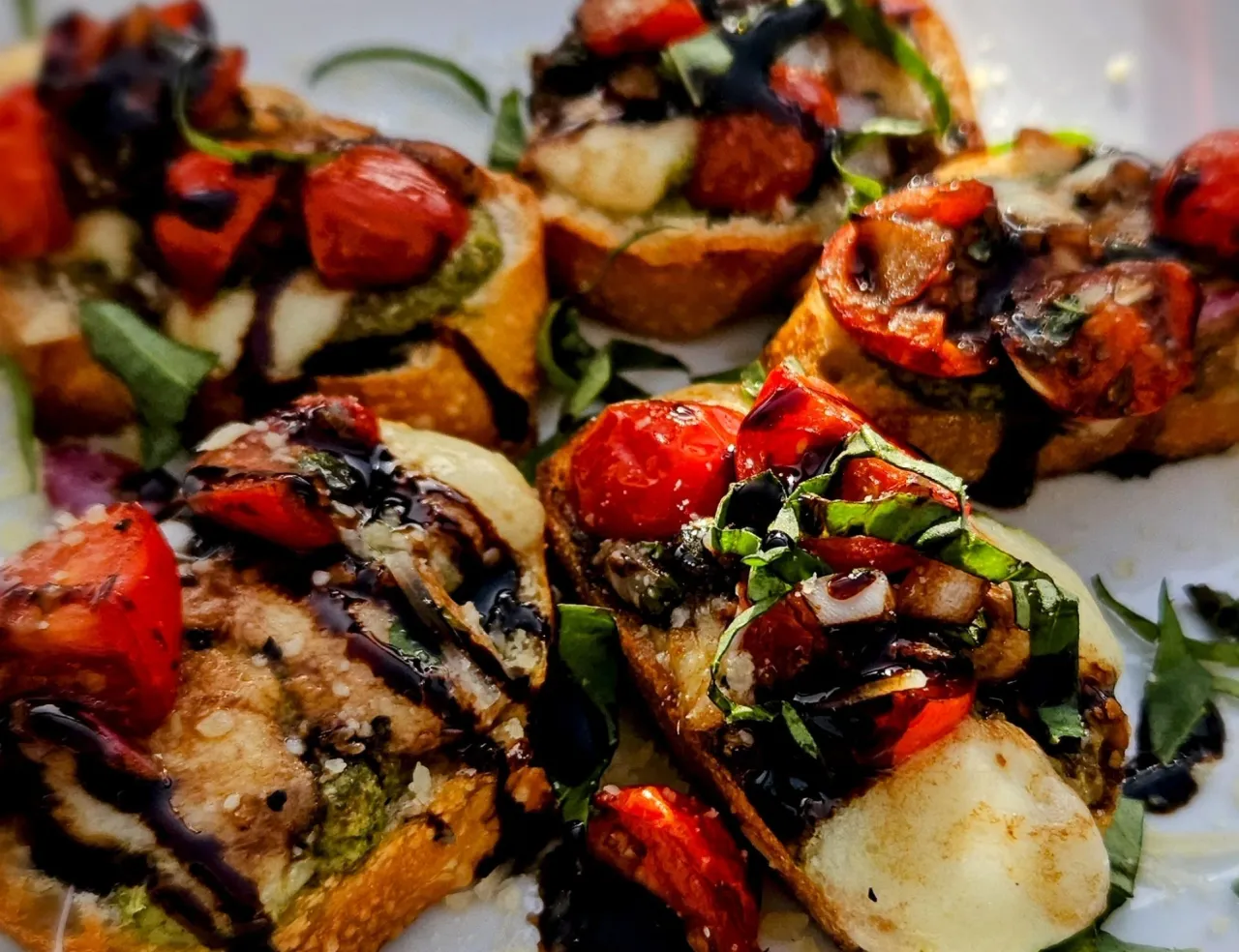 Tomato and mozzarella bruschetta finished with balsamic glaze